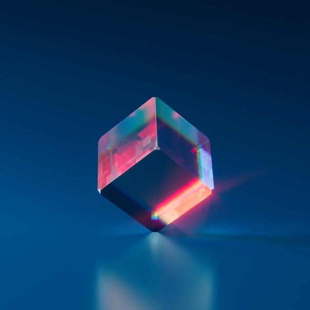 image of a 3-D cube balanced on one of its edges